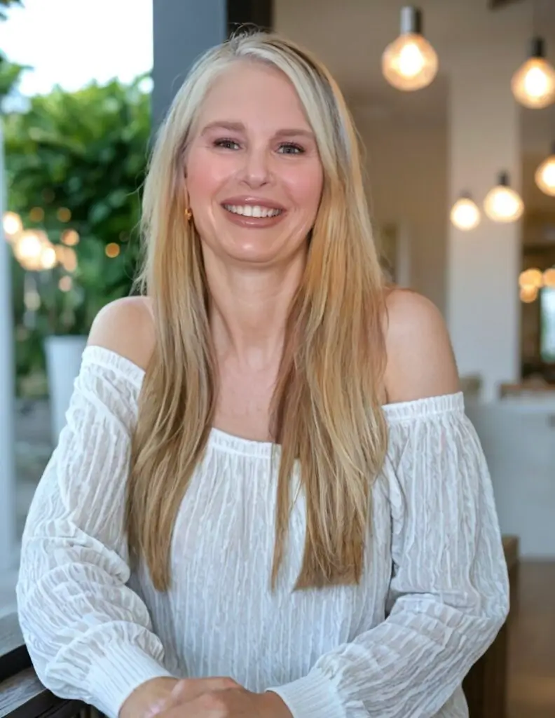 girl with long blonde hair and white off the shoulder shirt